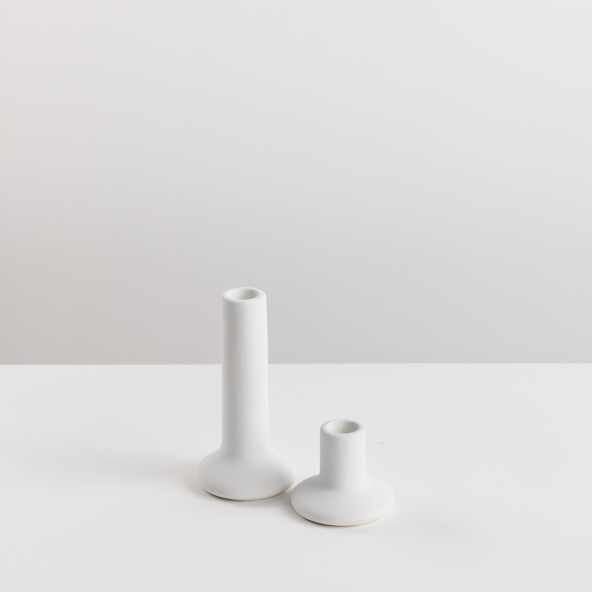 Pair of Bondi Scent taper candle holders on white background
