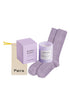 Lavender socks, candle, and packaging on a white background