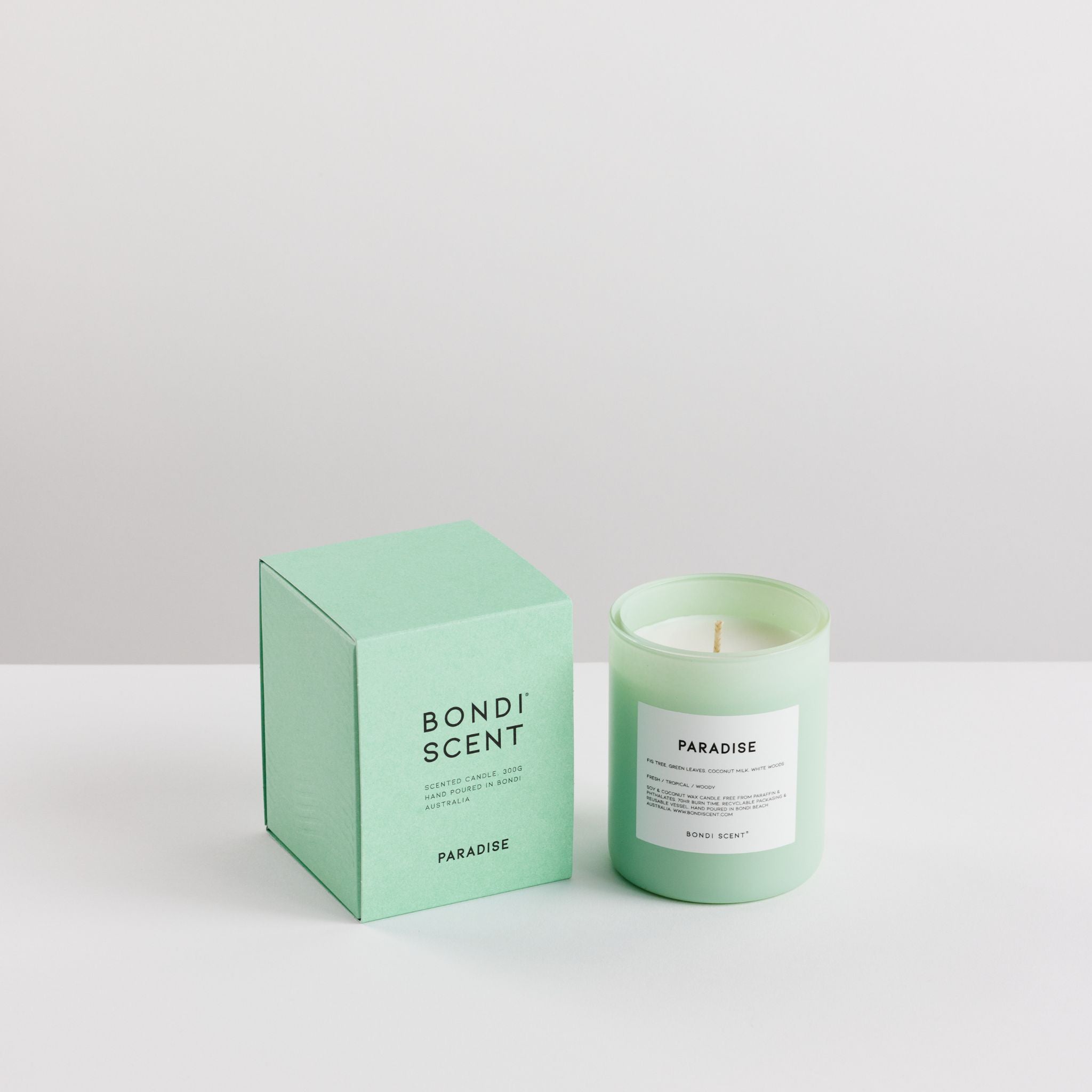 Green candle and packaging with &