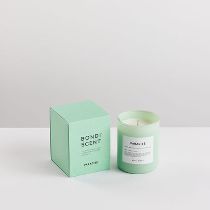Green candle and packaging with &