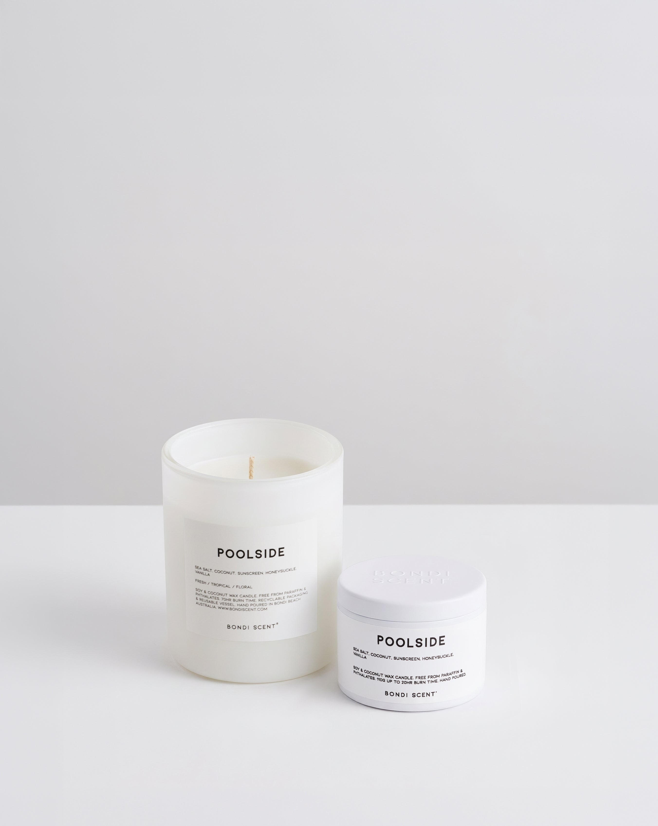 A white glass jar candle and a white plastic jar cream from the brand POOLSIDE, both labeled &