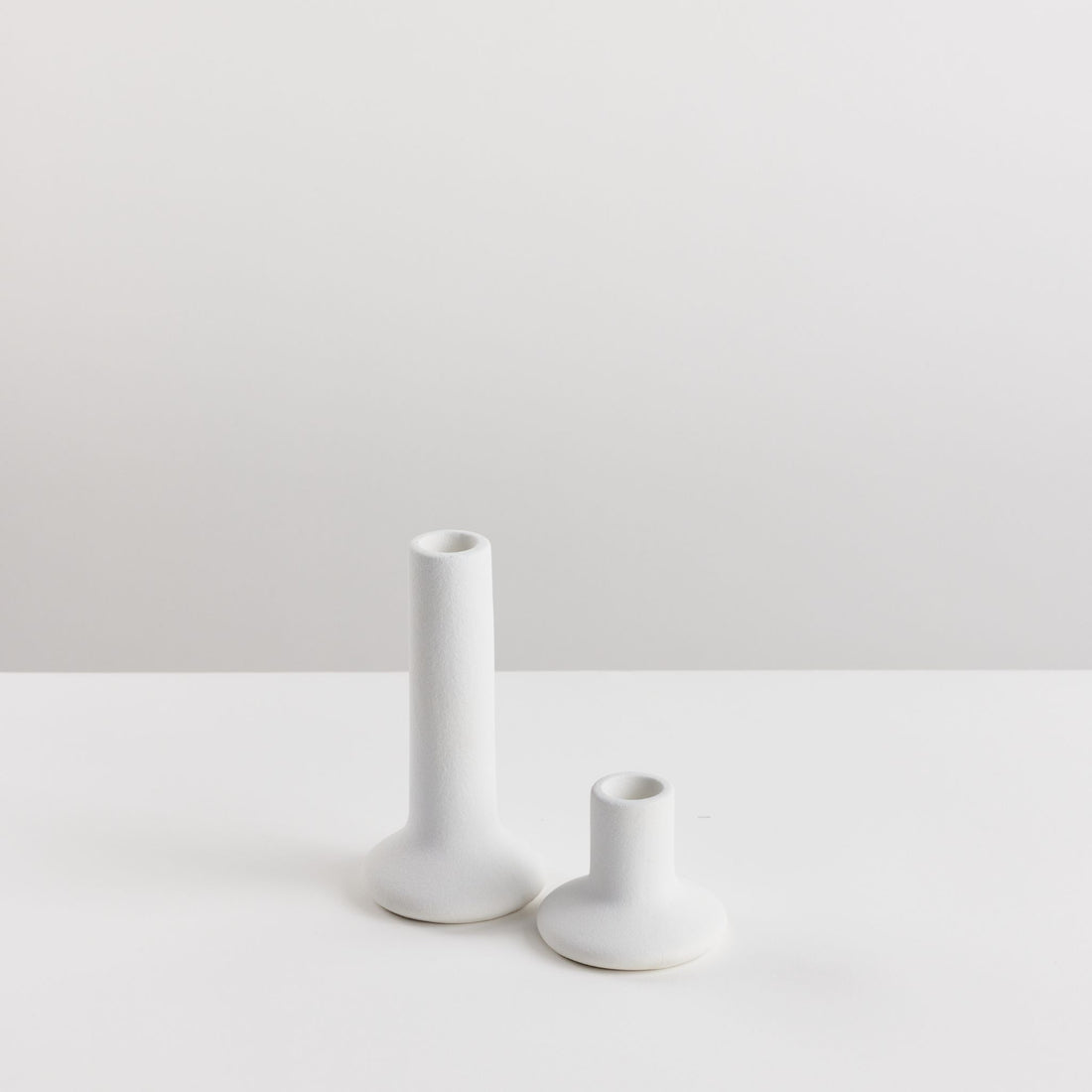 Pair of Bondi Scent taper candle holders on white background