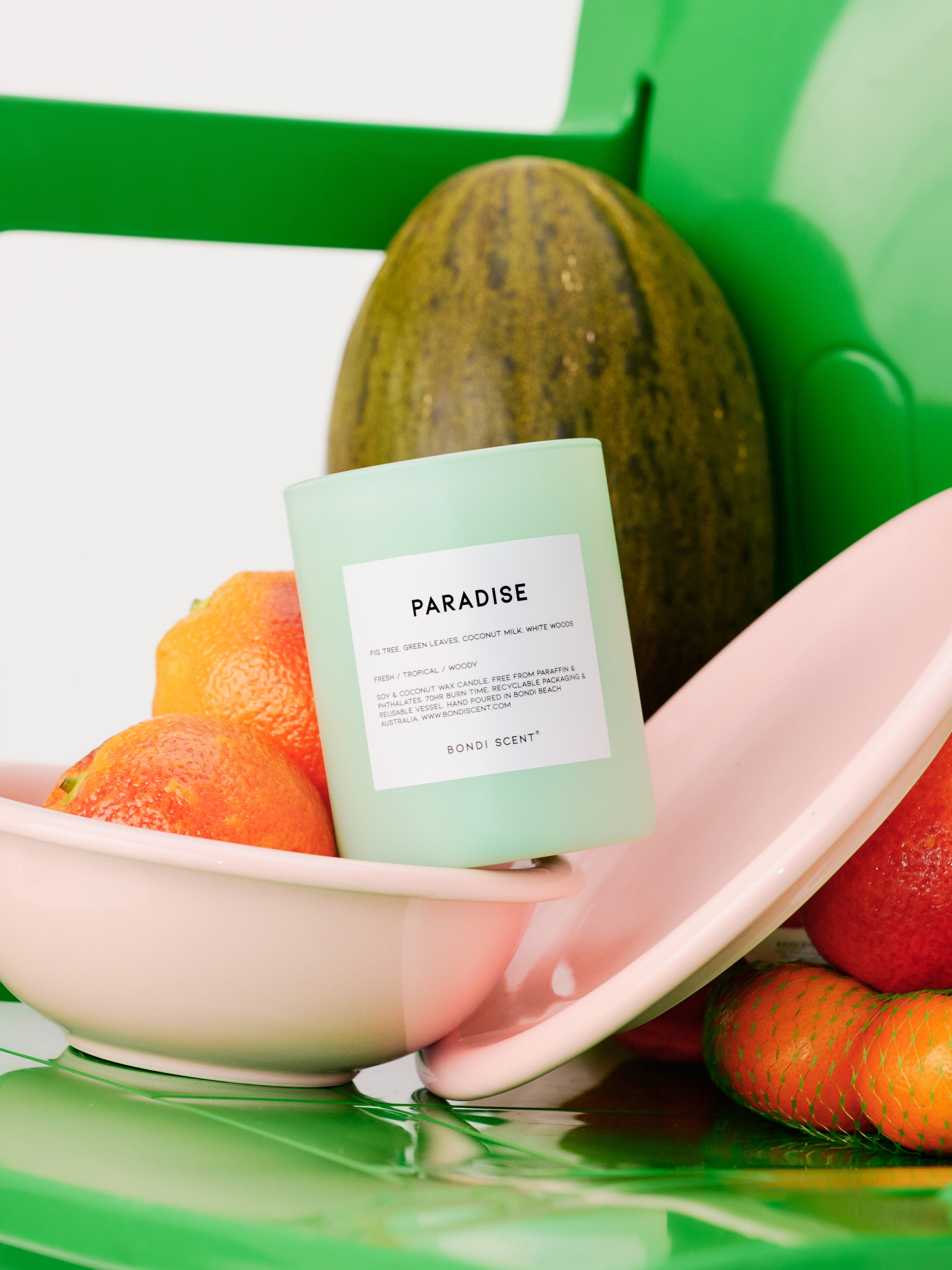 Bondi Scent 'Paradise' scented candle with fruits on green chair
