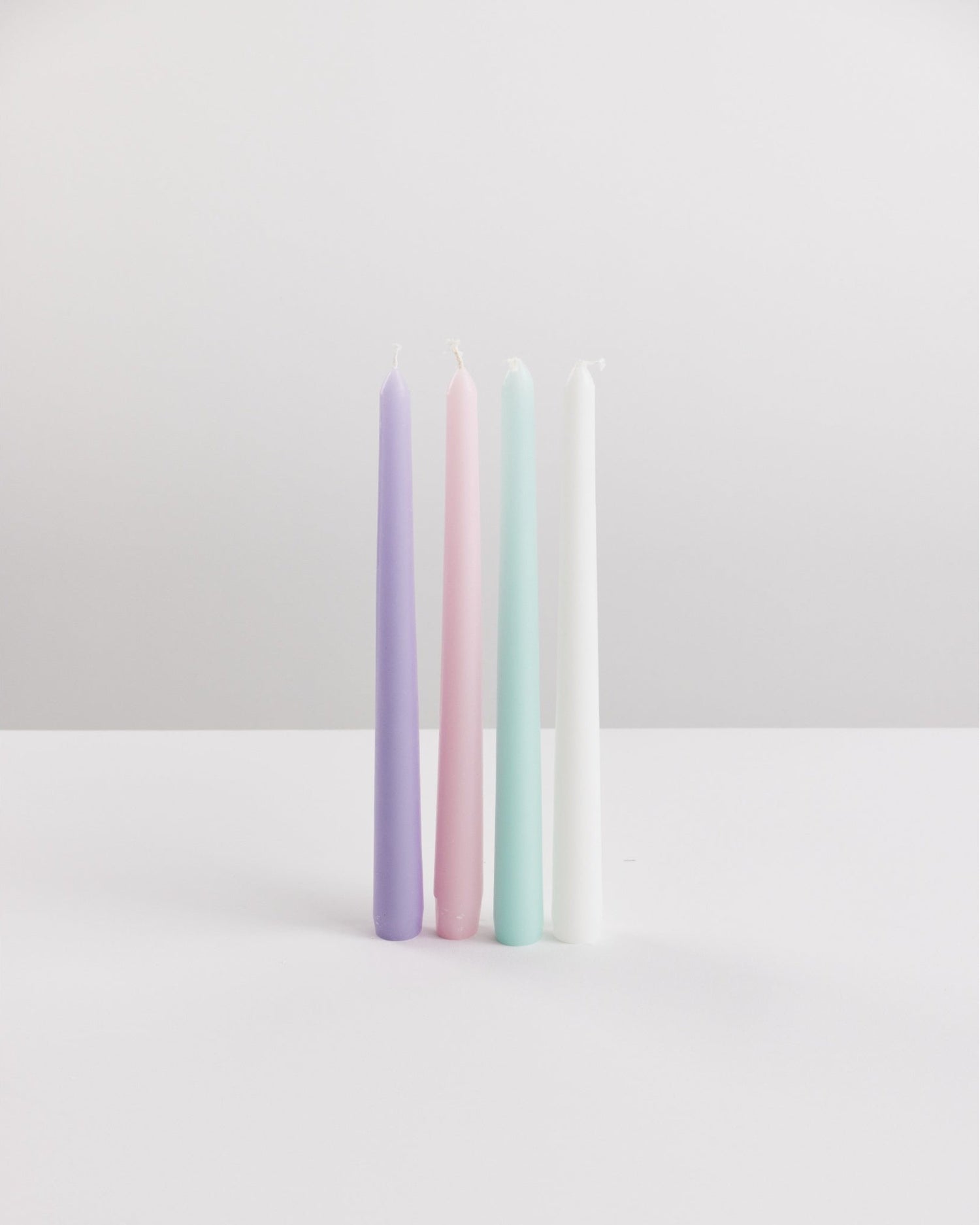 Bondi Scent multi colour taper dinner candle bundle on white background