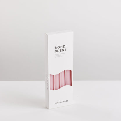 Bondi Scent pink taper dinner candles in packaging box on white background