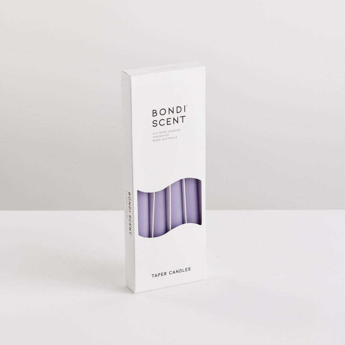 Bondi Scent violet taper dinner candles in packaging box on white background