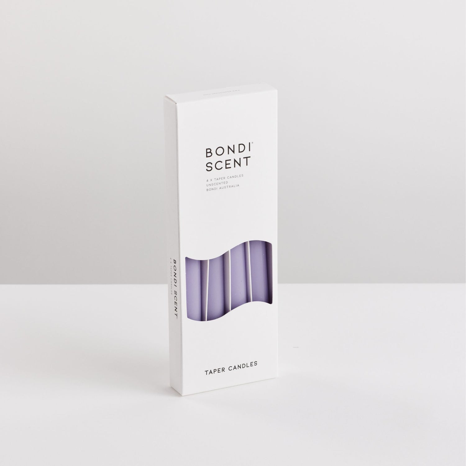 Bondi Scent violet taper dinner candles in packaging box on white background