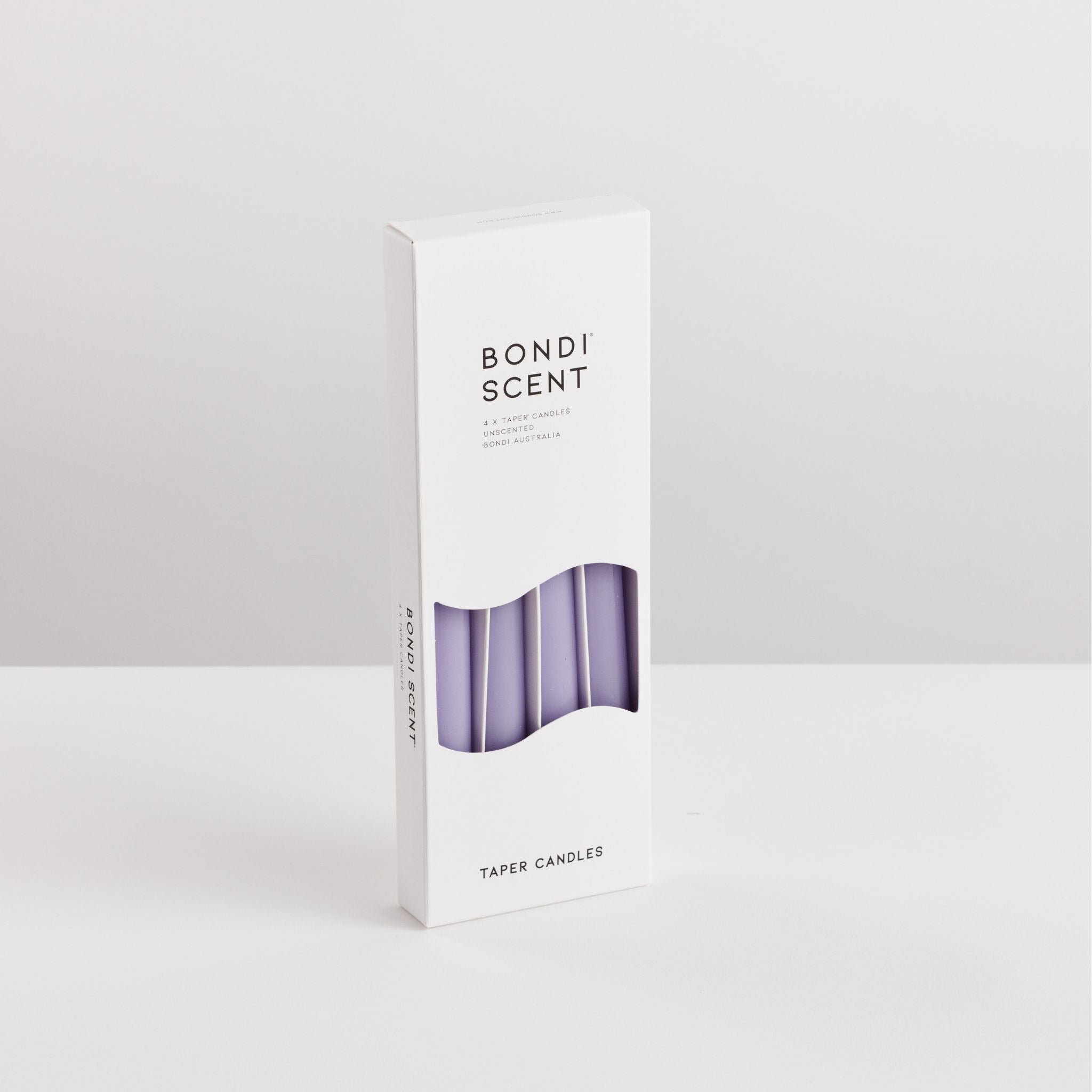 Bondi Scent violet taper dinner candles in packaging box on white background