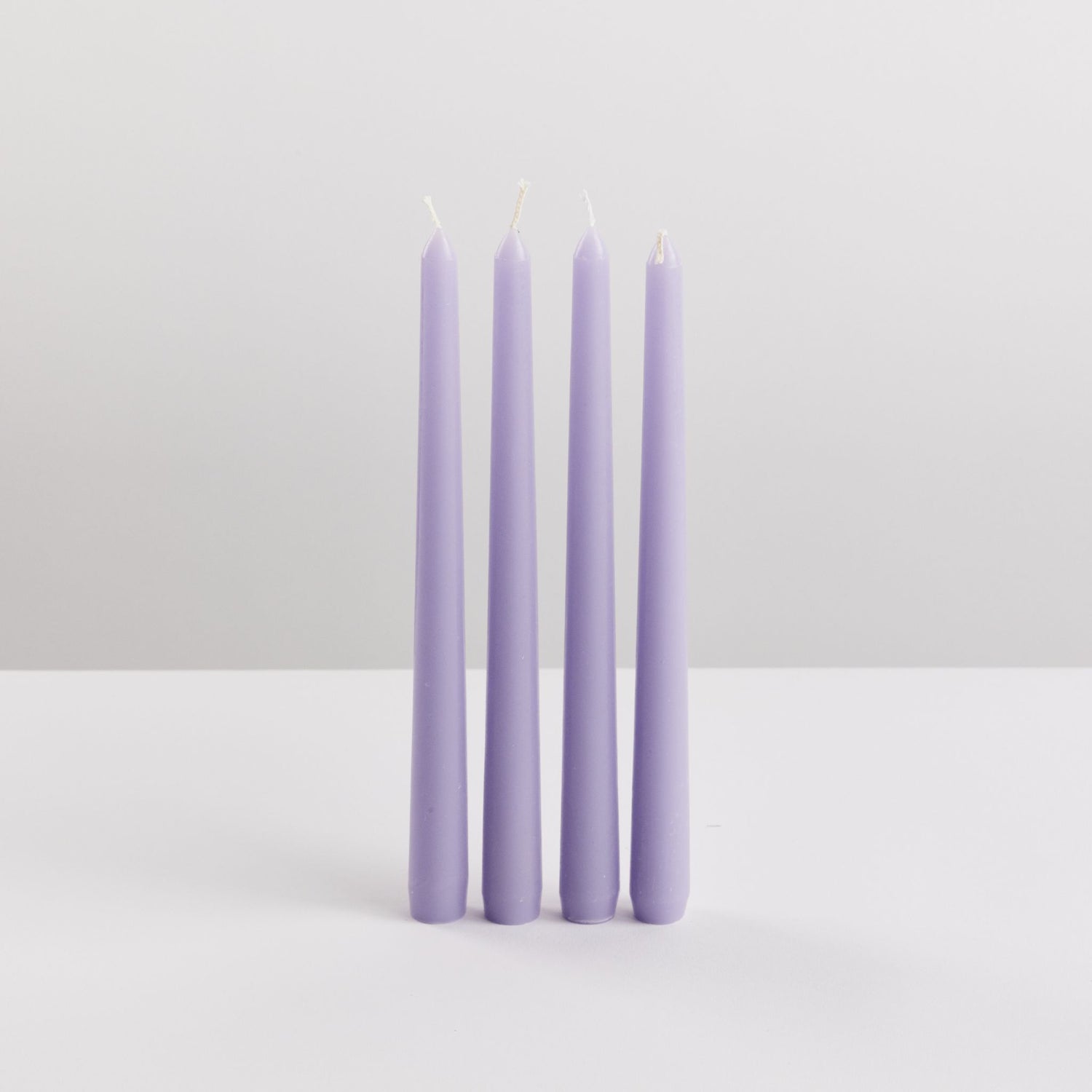 Bondi Scent violet taper dinner candle bundle on white background