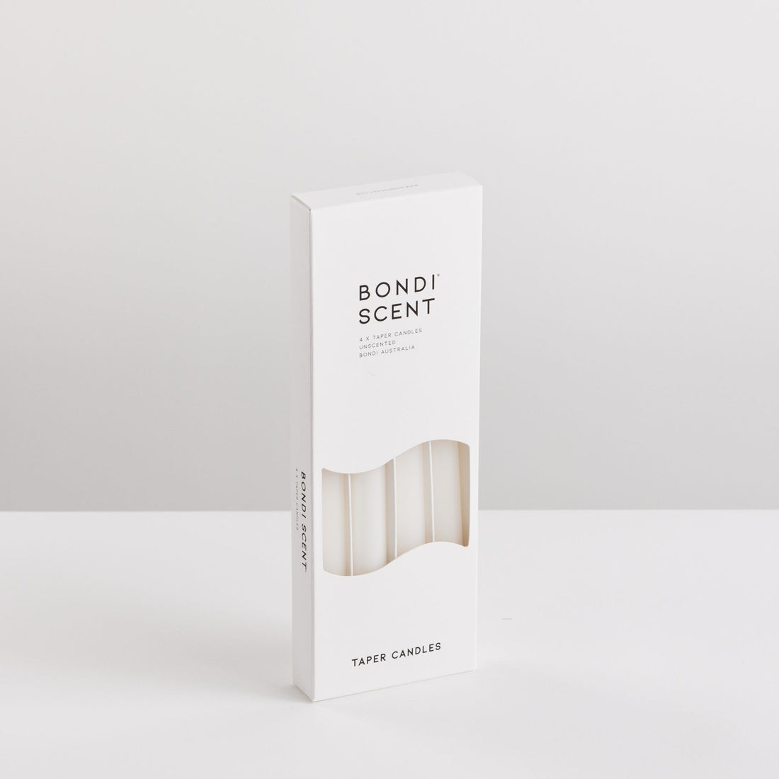 Bondi Scent white taper dinner candles in packaging box on white background