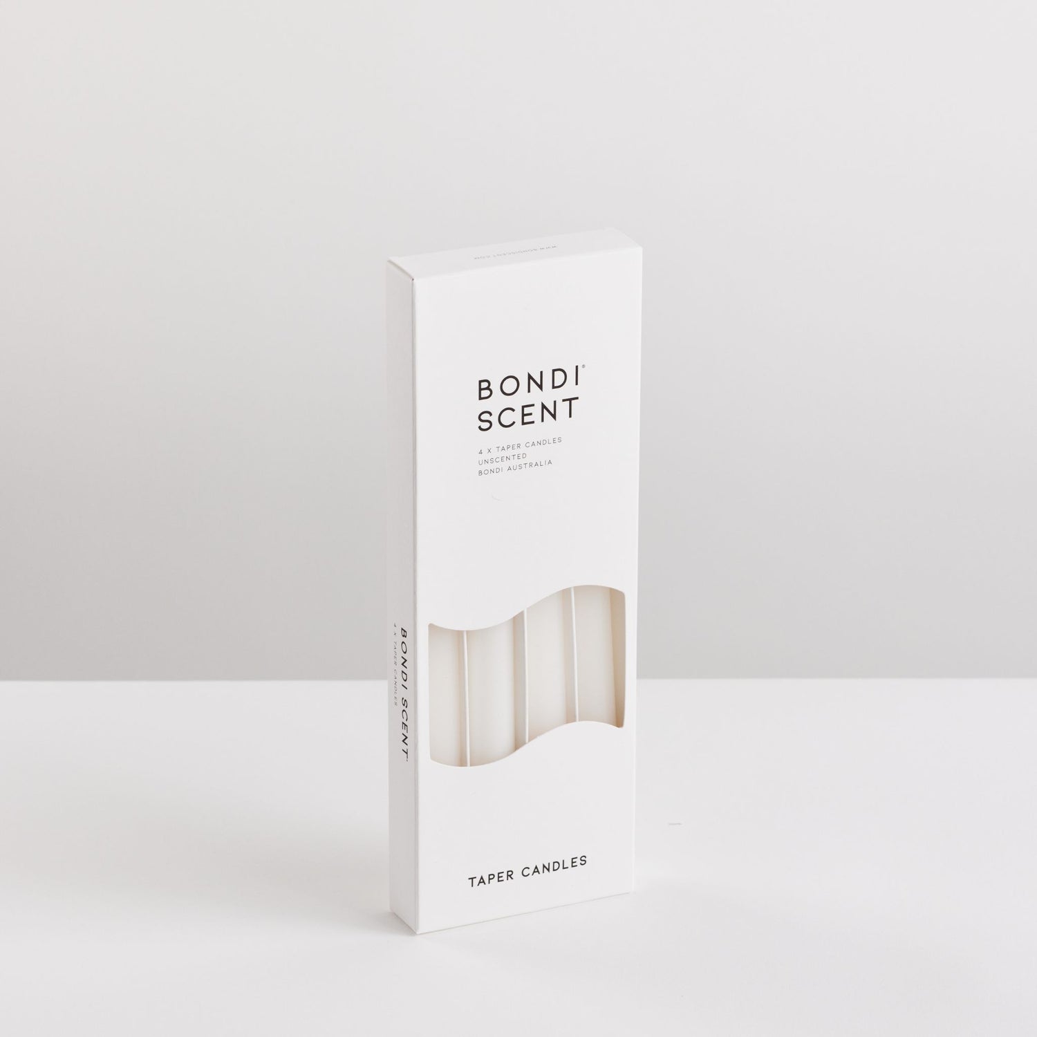 Bondi Scent white taper dinner candles in packaging box on white background