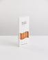 Bondi Scent orange twisted dinner candles in white packaging box on white background
